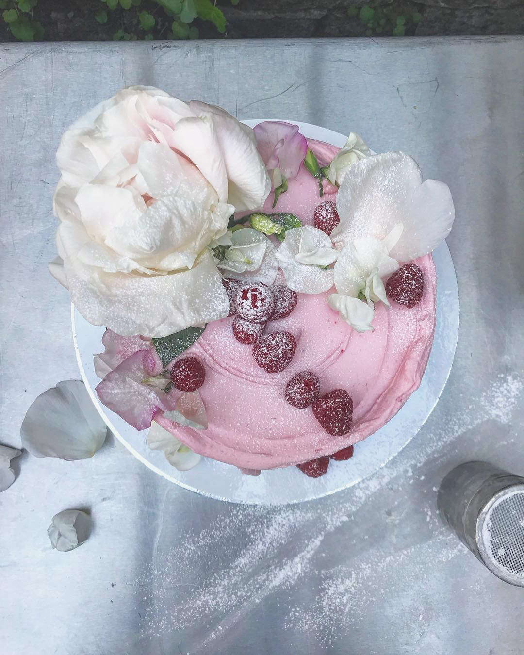 Raspberries and roses topped a recent Ptak cake creation.