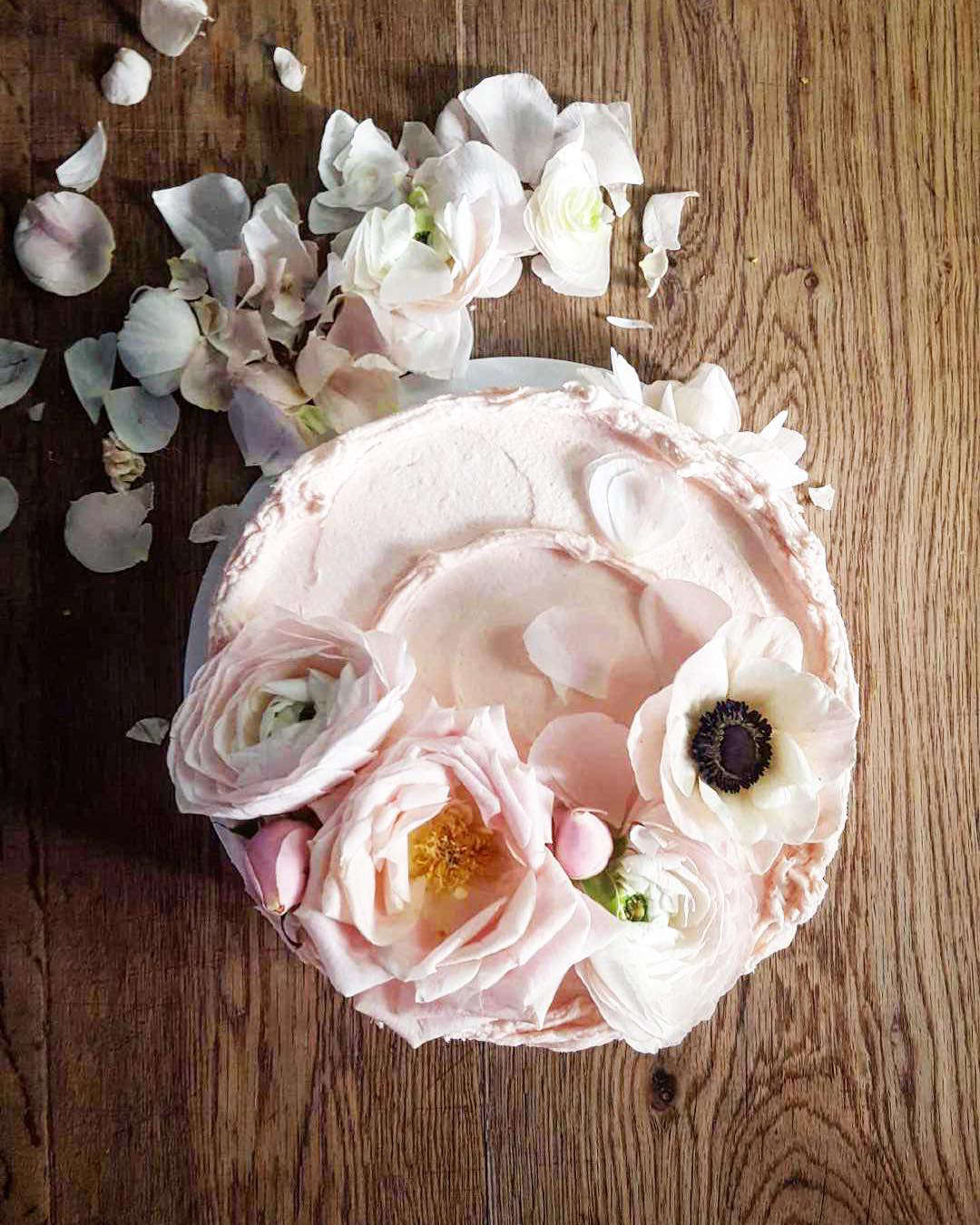 We can report with authority that this is not what the royal wedding cake will look like. This is a rhubarb birthday cake from Violet Cakes, decorated with pink roses and white anemones.