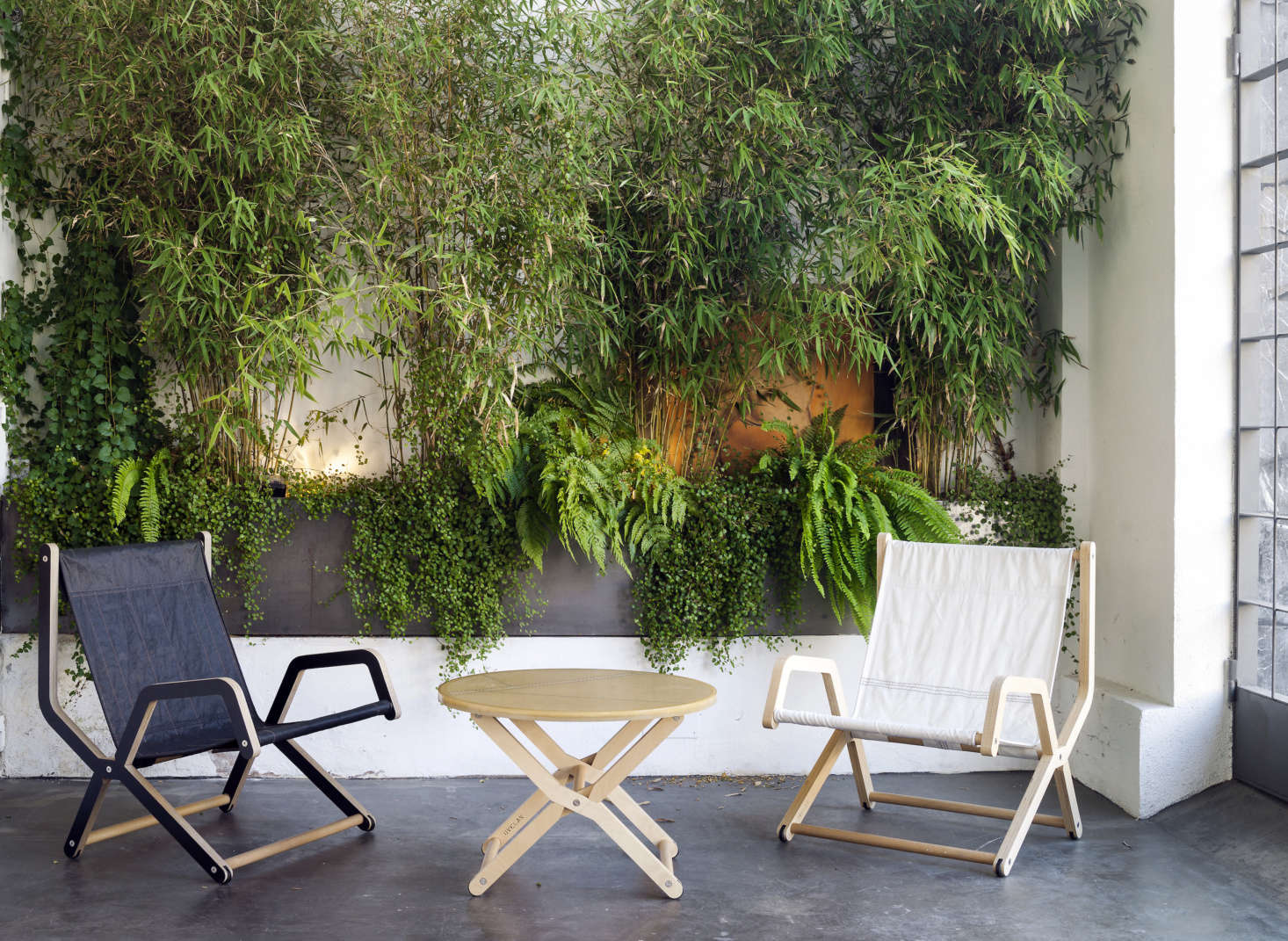 Cunningham Armchairs come in a black-stained and natural finish; $data-src=