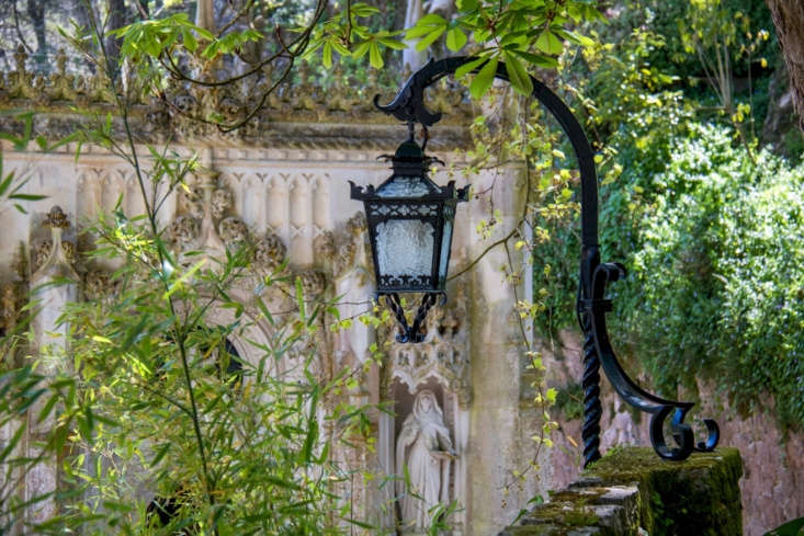 A monochromatic green backdrop adds drama to an ornate wrought iron lantern at the Quinta da Regaleira estate in Sintra. Photograph by Susanne Nilsson via Flickr.