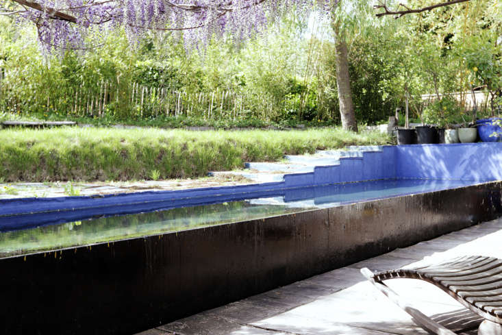 The exterior of the pool is painted black and the inside is painted a Yves Klein–inspired shade of blue. “I paint it every year,” he says.