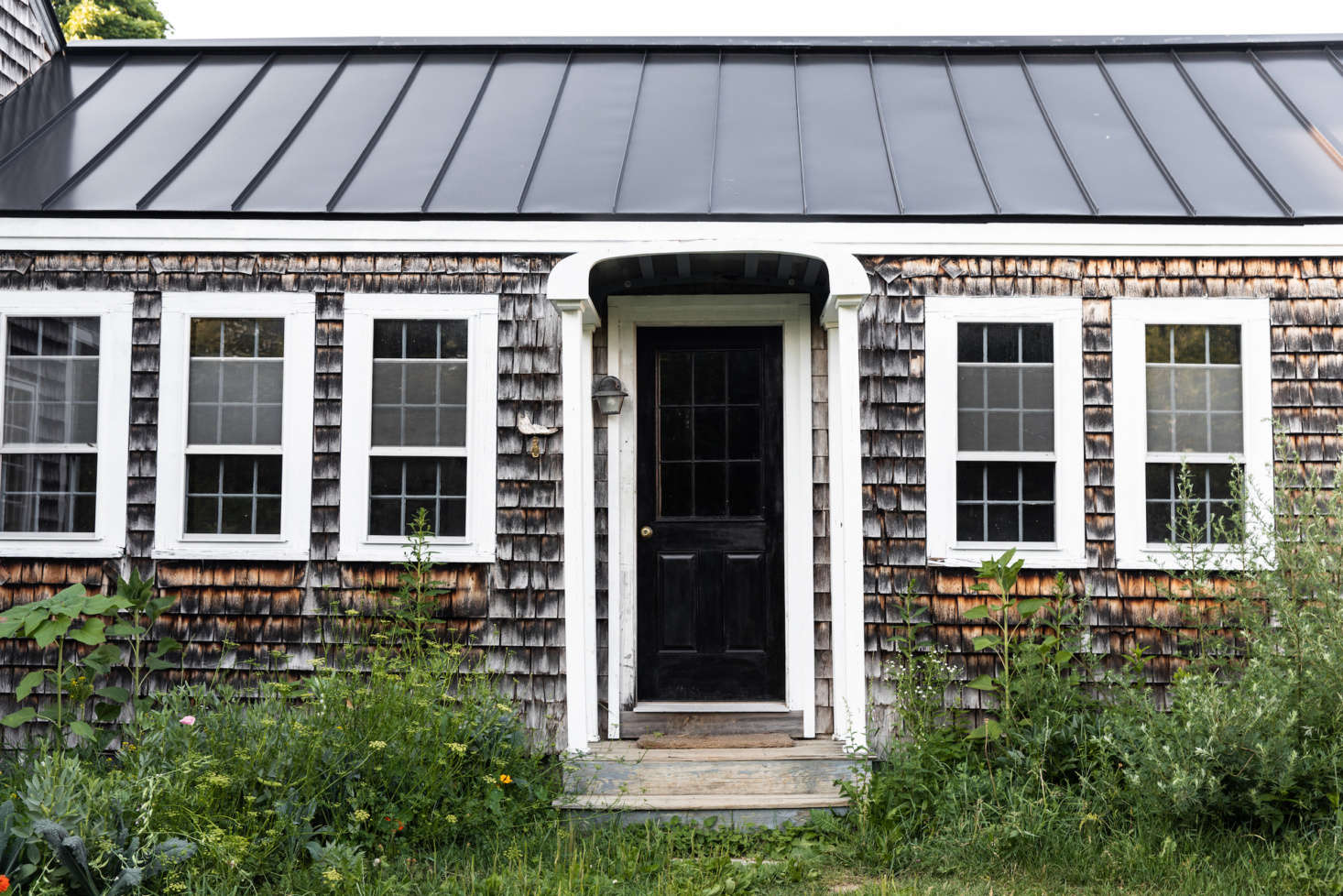 A major upgrade: the standing-steam metal roof, added last summer. “It’s a common, practical option in this climate,” Lafleur says. “In the winter, when the sun hits the roof, any accumulated snow slides down in these neat sheets.” (See Hardscaping data-src=