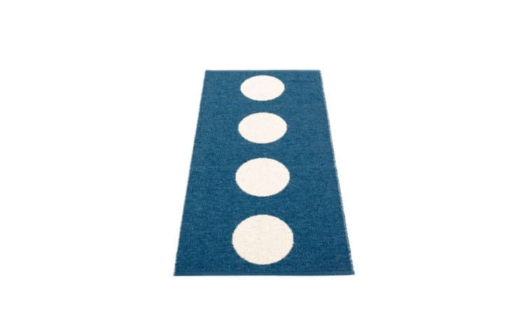 Pappelina&#8\2\17;s Vera Plastic Rugs, in ocean blue and vanilla, are \$93 to \$433 at Fjorn.