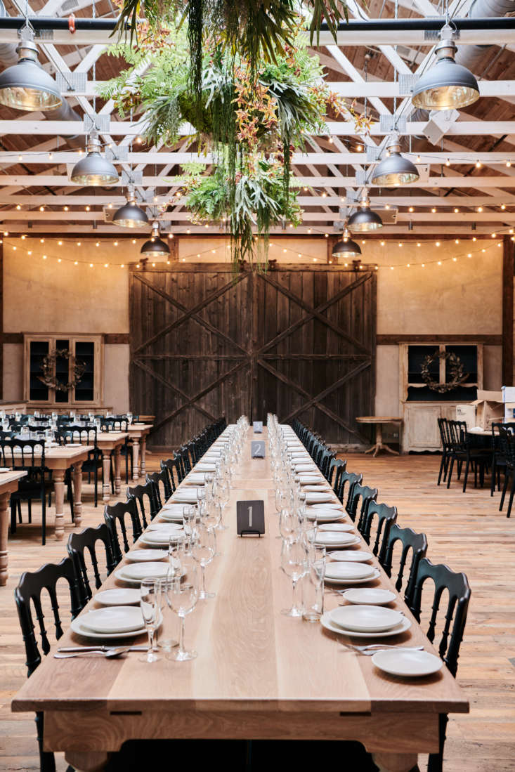 The high-ceilinged event space has reclaimed wood floors, farmhouse tables, and string lights someone else already hung for you. Guest capacity: \150.