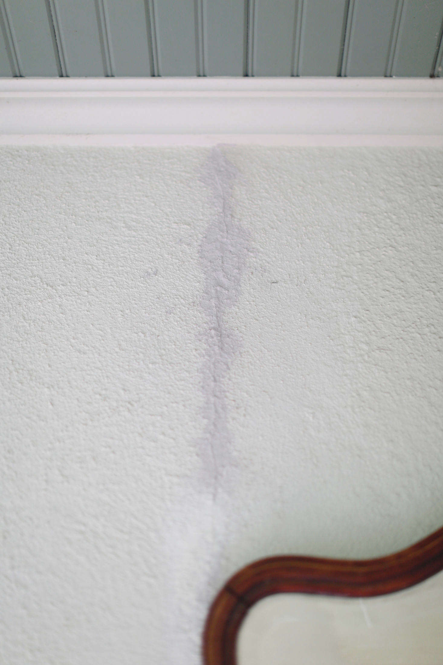 Over the years, a few cracks had appeared in the surface of the stucco.