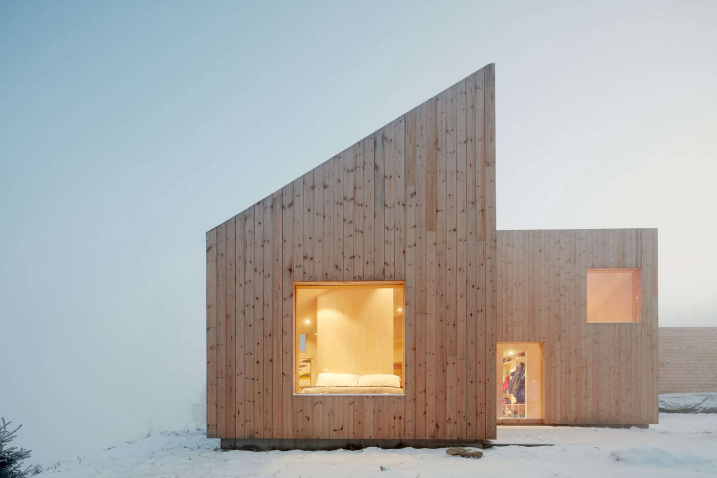 The untreated pine siding will weather to a silvery gray over time.