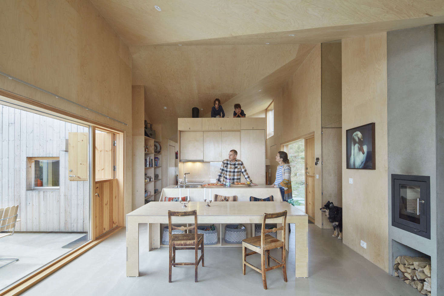 The design created two outdoor terraces, each with two walls to block wind and a half-gable roof to divert snow.