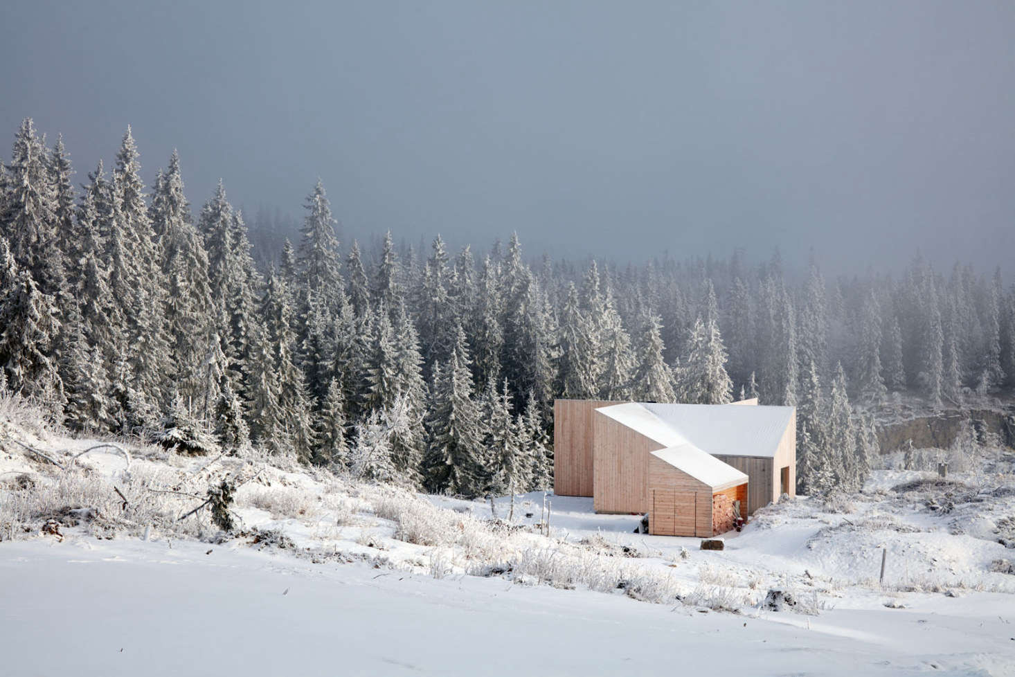 The cabin sits at the edge of Mylla Lake, an hour