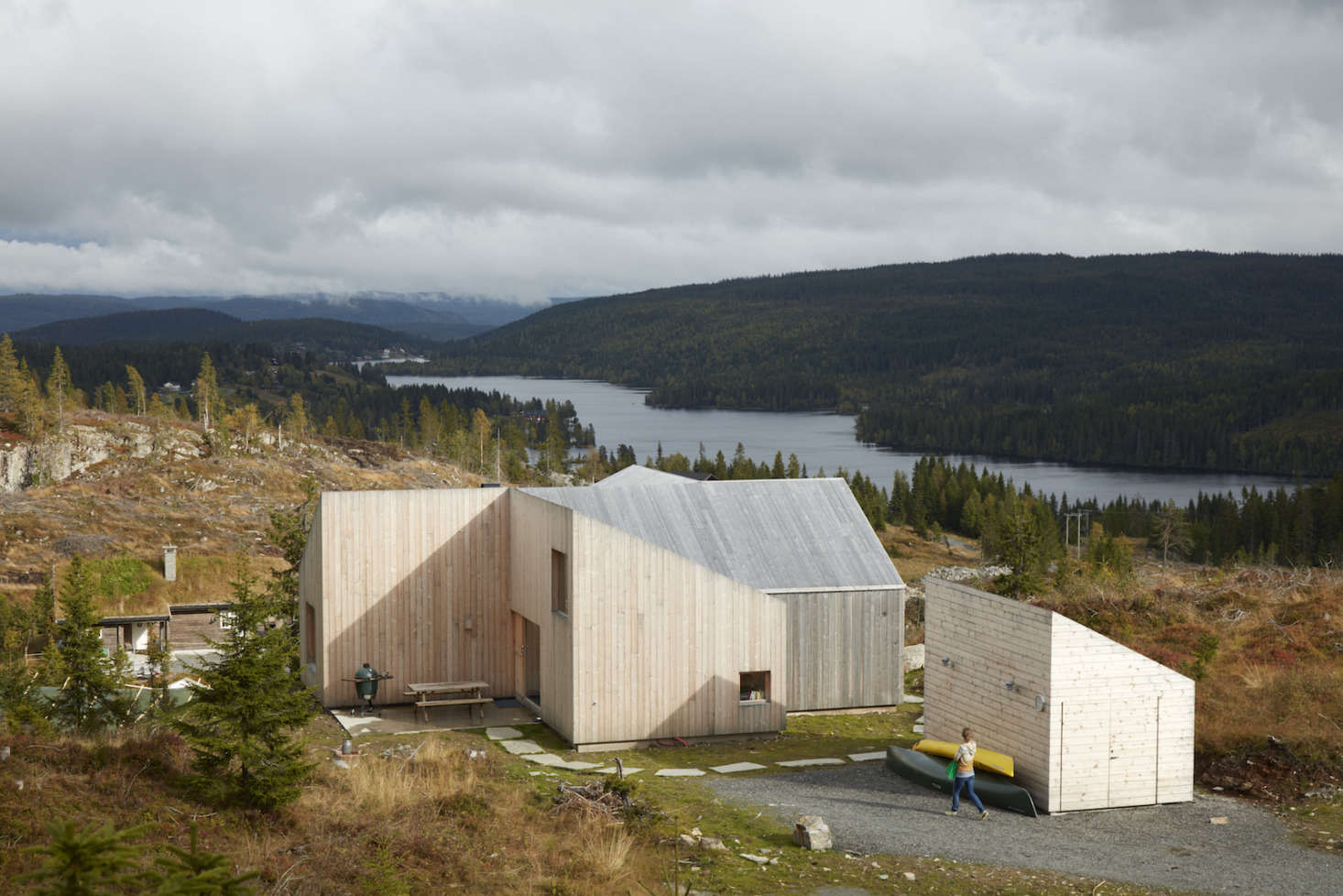 The exterior is sided with untreated pine and the roof also is clad in wood.