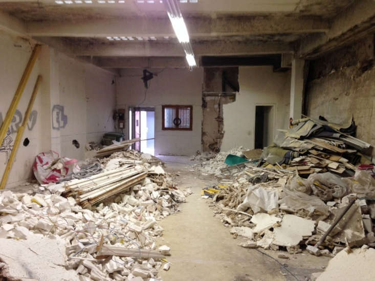 This is what the courtyard looked like pre-demolition, with a roof overhead. “Given the price of real estate in Paris, we had to find something that no one else wanted,” says Gilles. Photograph by Guillaume Terver.