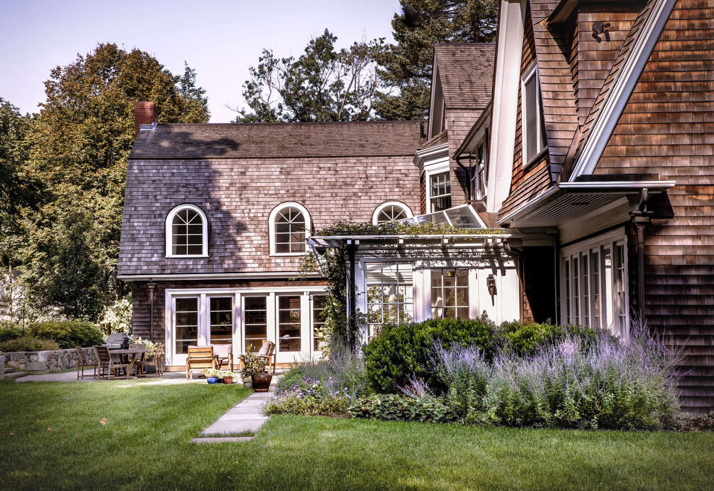 Adjacent to the house, a sheltered bluestone patio provides the main outdoor eating and entertaining area.
