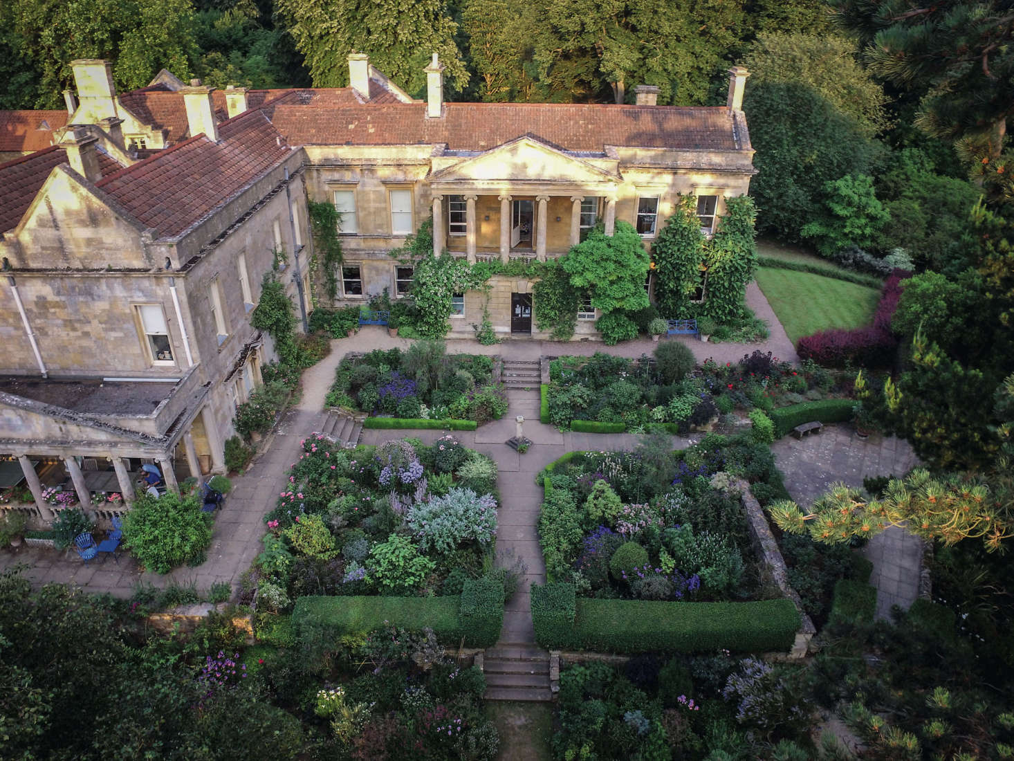 “An aerial view shows the strong structure and shapes of the planting in the Four Squares. Encircling the lawn to one side of the house is the brilliant hedge of Berberis thunbergii f. atropurpurea ‘Rose Glow’,” writes Berridge.