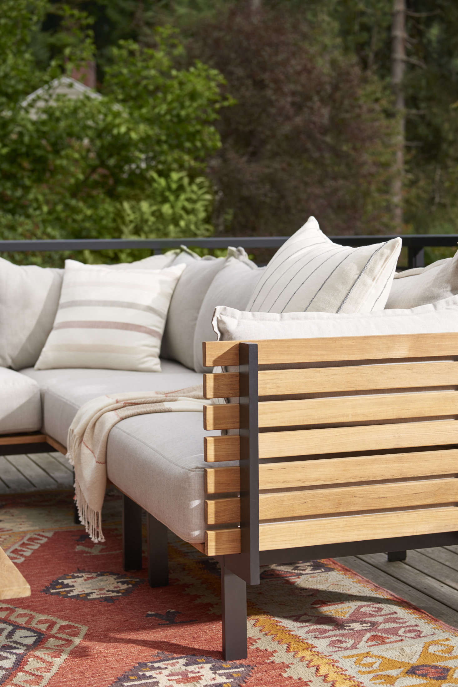 A weather-proof rug adds texture and creates the feeling of an outdoor room. We like the Cleary Indoor/Outdoor Flatweave Rug ($849), shown here in the Cleary Rust colorway, which is water-resistant and made from 0 percent recycled-polyester yarn.
