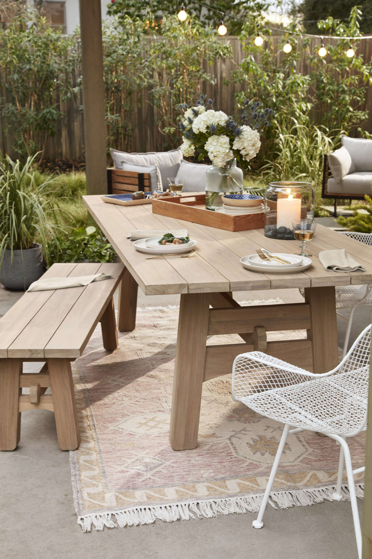 A serene set-up for dinners outdoors: the Ronde Teak Dining Table ($data-src=