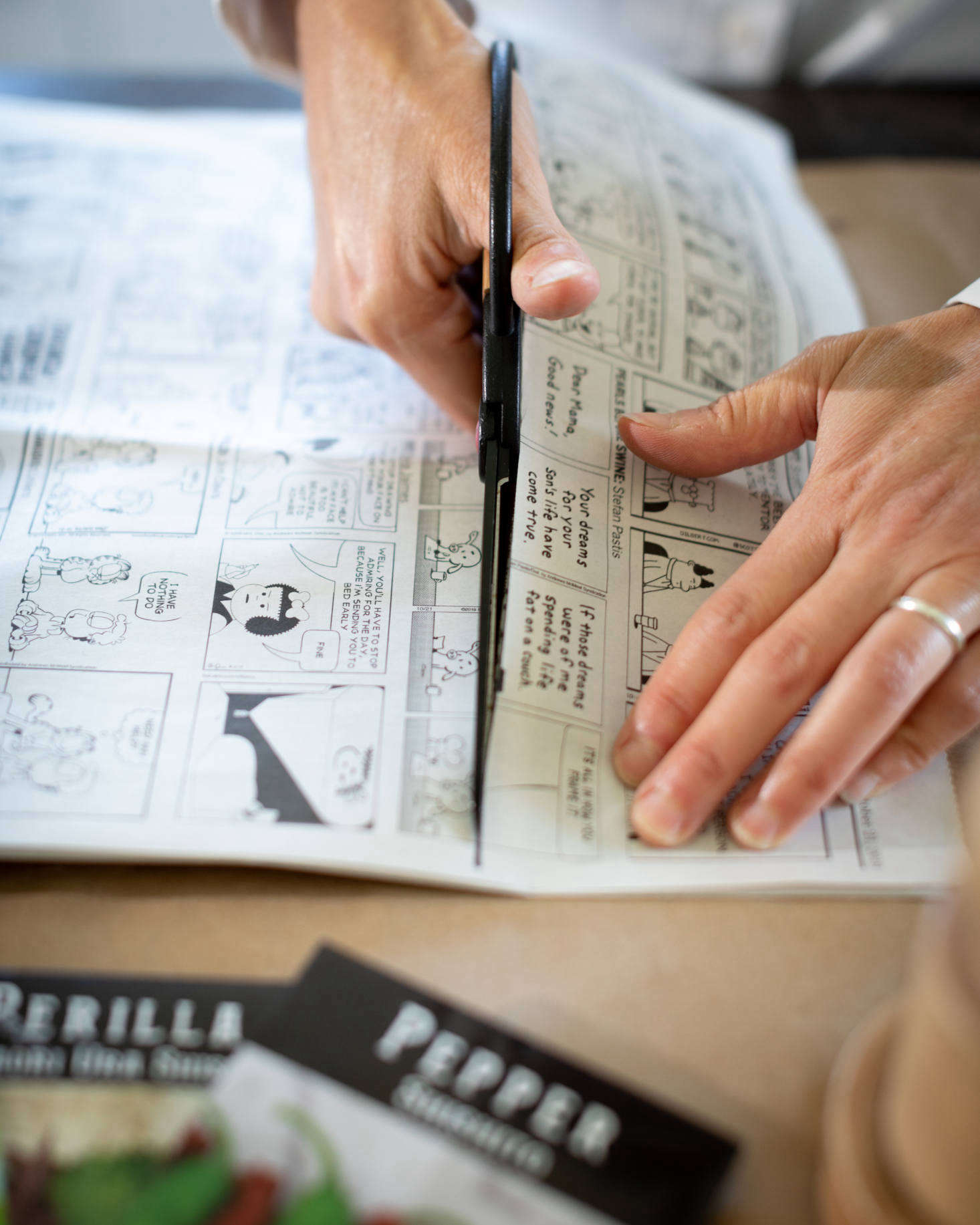 Measure and cut newsprint strips that are about twice the height of the pot maker base. If you don