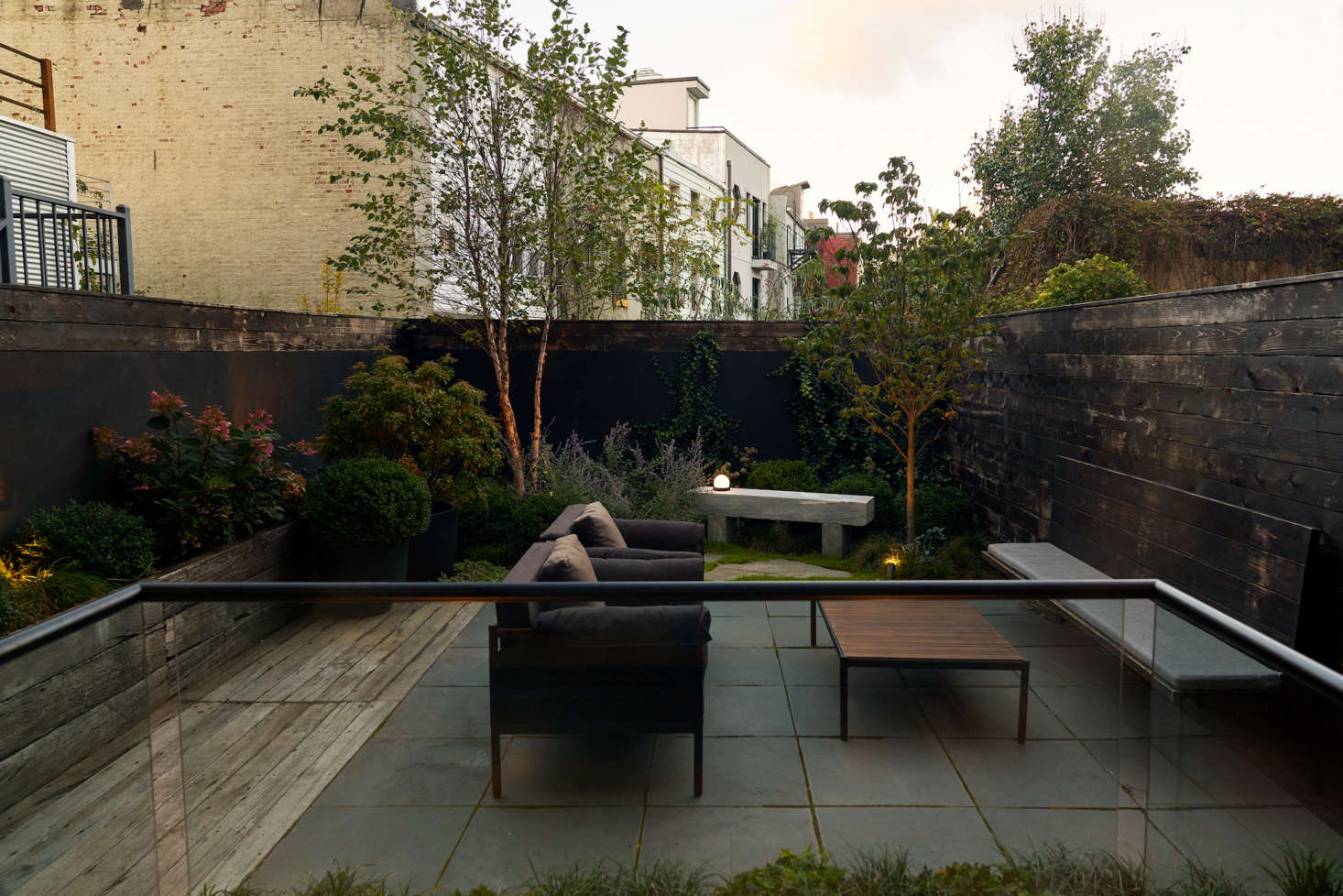 The outdoor lounge chairs and coffee table are by Adolini+Simonini.