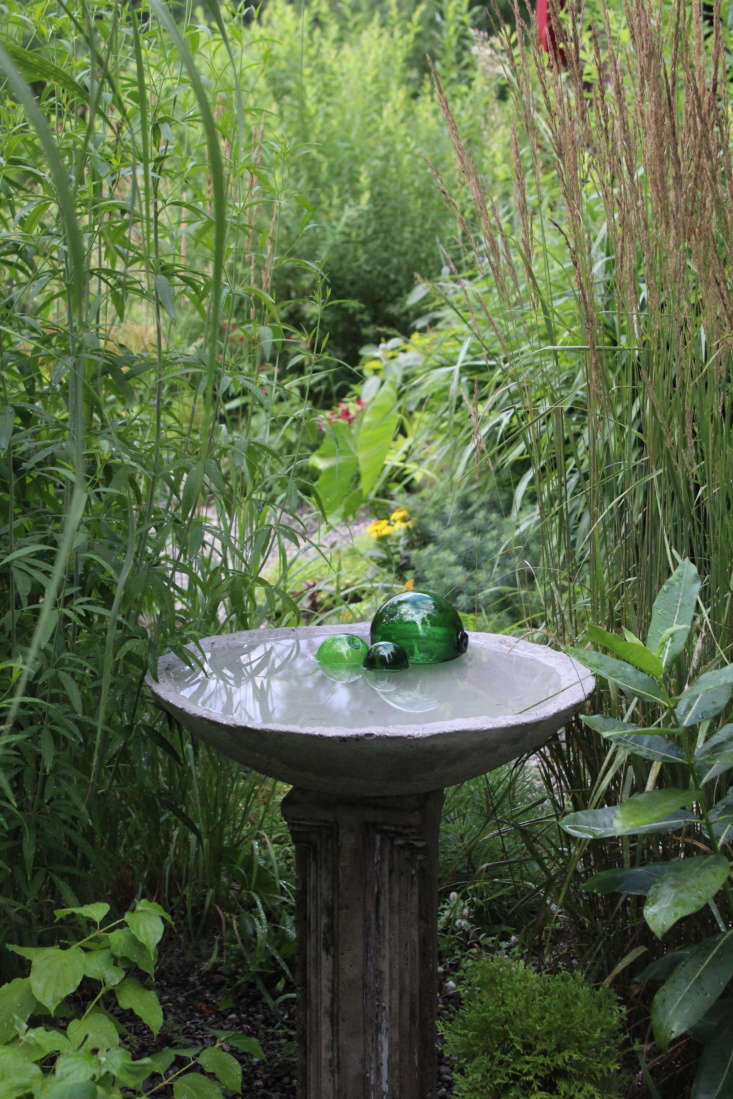 Garden designer Todd Carr crafted this water bath for his home garden in Oak Hill, NY. Photograph by Todd Carr, courtesy of Hort and Pott, from Garden Visit: A Couple’s Lush and Romantic Sanctuary in the Catskills.