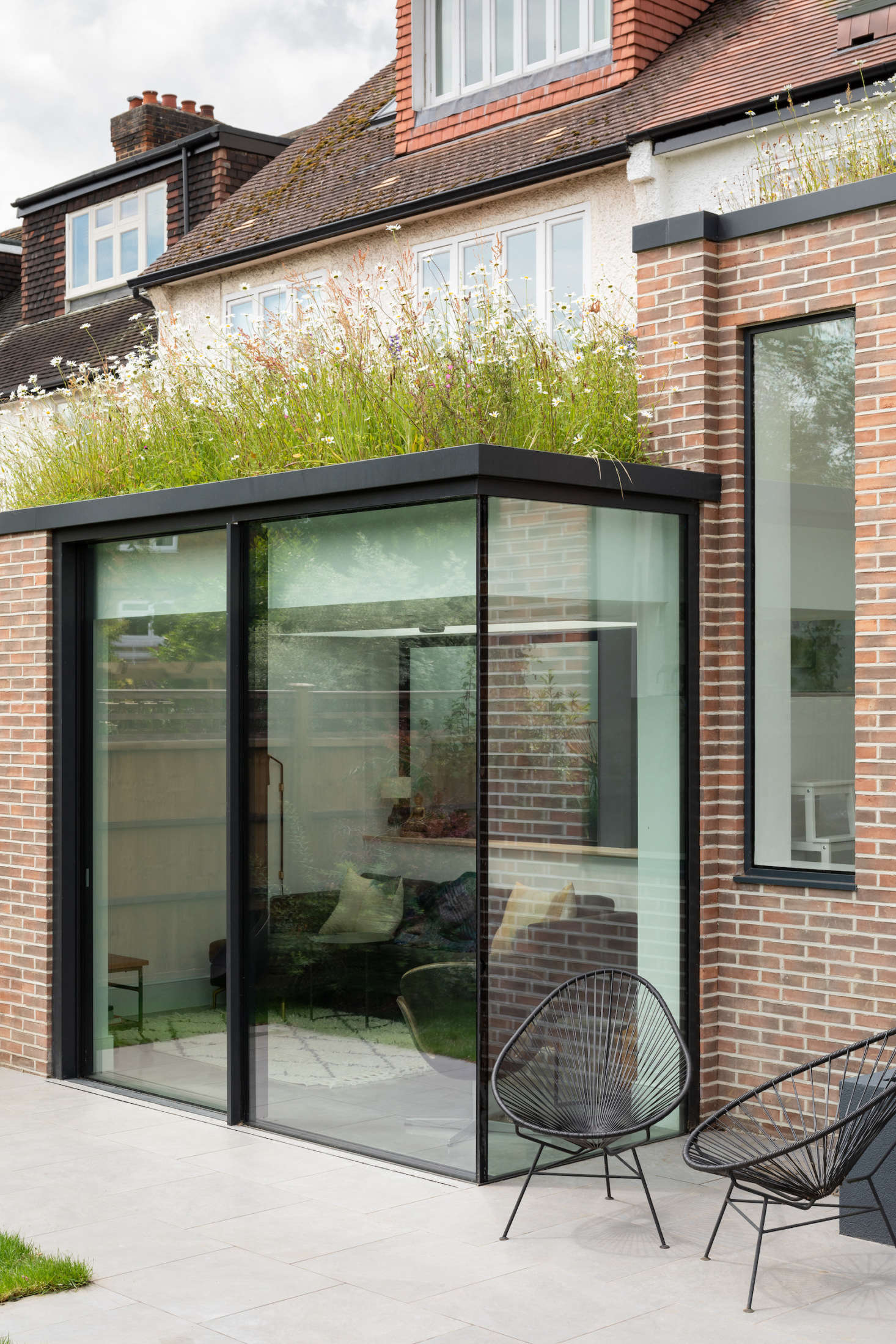 Aside from the kitchen and dining areas, the extension includes a snug room, right under the wildflower roof.