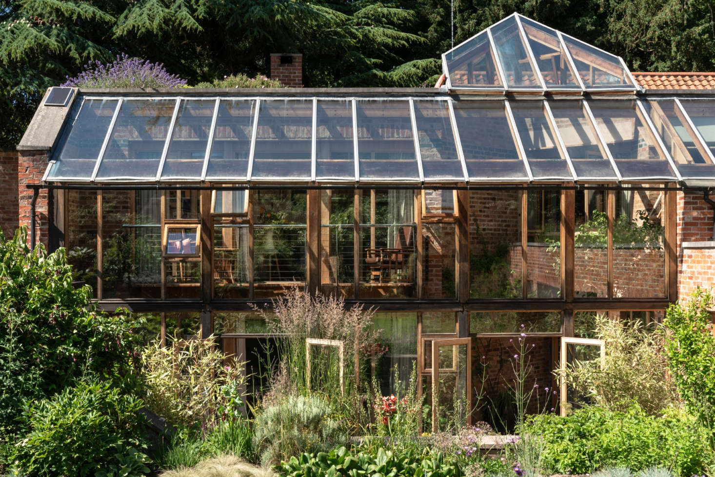The defining feature of the house is a conservatory that promotes indoor-outdoor living. More importantly, it
