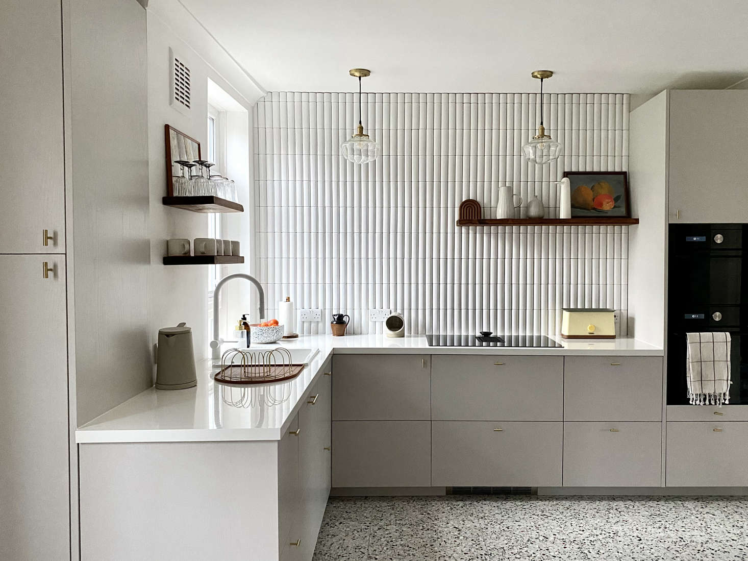Another high/low kitchen, thanks to Ikea base cabinets and fronts by Naked Doors. The homeowners here also saved by choosing Ikea appliances. Photograph by Ferren Gipson, from Kitchen of the Week: An American In London Creates Her Dream Ikea Hack Kitchen.