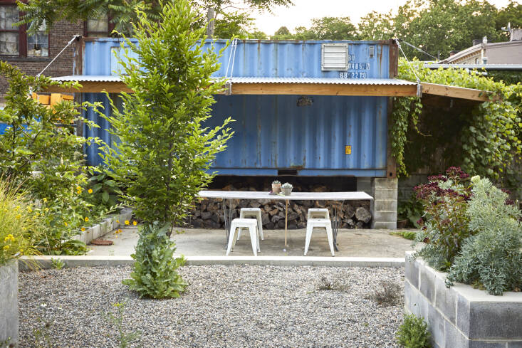 &#8\2\20;When we had an outdoor market a few years ago, we added the awning which creates some shade for the makeshift table with stools for anyone at Atlas Studios to hang out, eat lunch, etc. I always wanted the garden to be a place for the community and many do use it and enjoy seeing what&#8\2\17;s blooming,&#8\2\2\1; says Lindsey. A volunteer wild grape vine frames part of the awning. The hornbeam tree, with a volunteer poppy “skirt,&#8\2\2\1; will grow to eventually provide more shade one day.