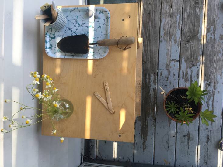 A ceramic cup holds floral wire and wooden plant markers; the cup and the Studio Formata tray are both from nearby Blanche + Mimi. The two-handled vase is the Bagno \2 Anses by La Soufflerie, found at The Post Supply in Portland.