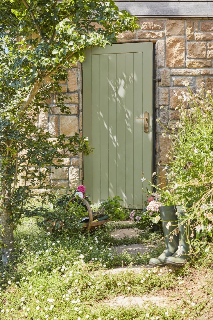 The exterior paints can be used on wood, masonry, or metal. Pictured is Boringdon Green on the door.