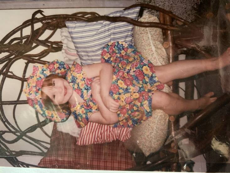 Young Molly in a festive, floral outfit.
