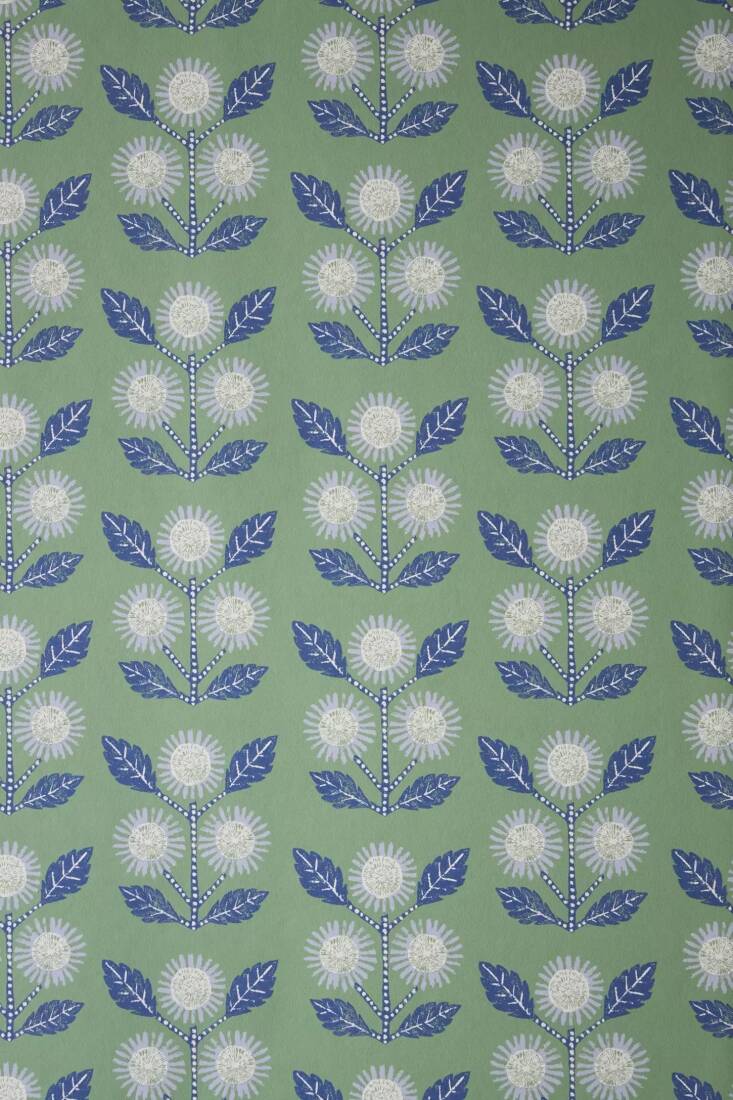Merchant&#8\2\17;s exclusive wallpaper and soft goods collection for Anthropologie is available in the US and UK with slightly different offerings in each country: made-in-the US Ellen Merchant Green Wallpaper is \$99 per roll and an Ellen Merchant Cottage Throw Blanket in the same pattern is £98.