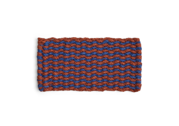 Hay is our go-to for modern, fun door mats—and this one, in brown and navy, is particularly appealing. Shop now.