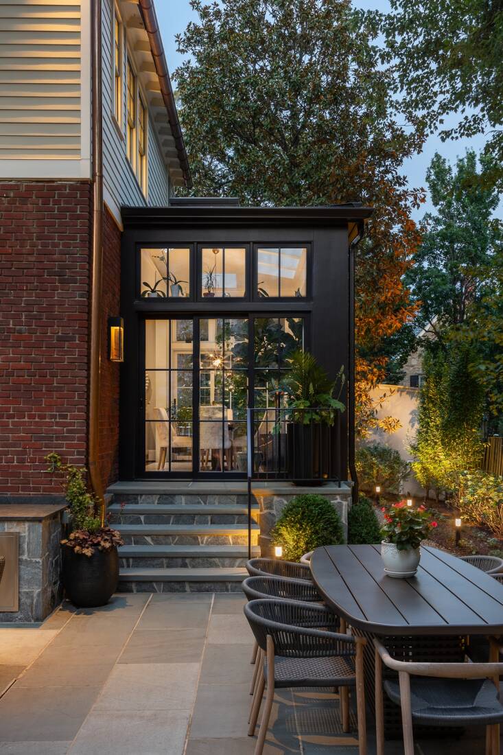 During the day, the solarium allows light to penetrate deeper into the house. But in the evening when it is lit within, the structure functions almost like a lantern in the landscape.