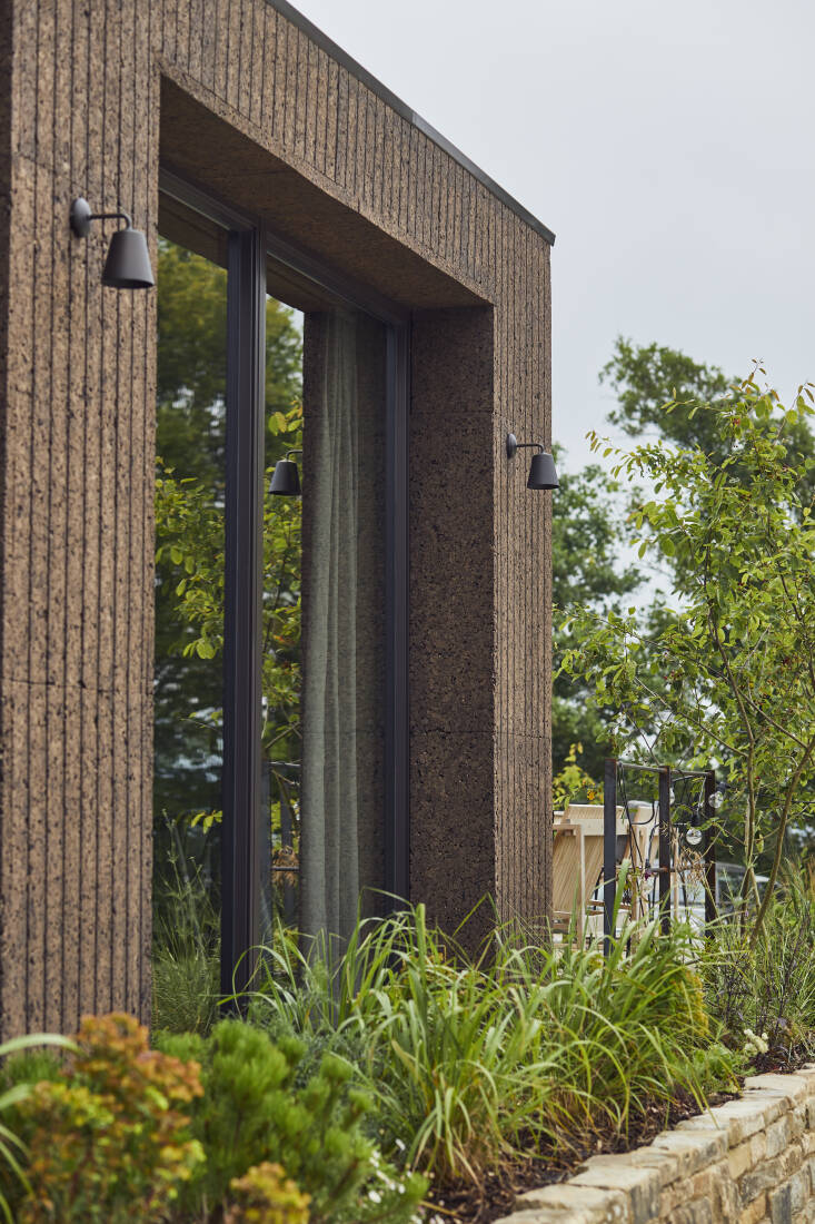 BOX9’s dining room extension was built with a super-insulated timber frame, then clad in a natural, carbon-capturing, weather-resistant cork blanket (@amorimcork).