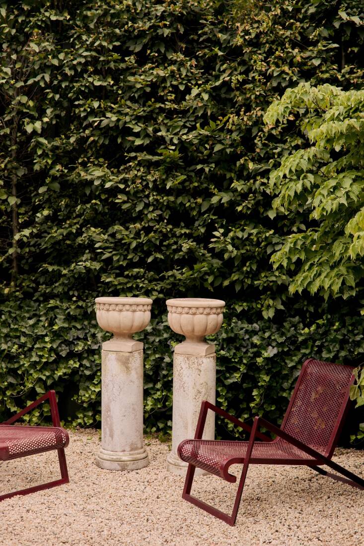 A pair of Royère-Style Perforated Iron Armchairs, circa \1990. See above for info on the planters.