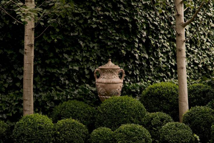 One of a pair of Terracotta Classical Lidded Urns in &#8\2\20;excellent vintage condition.&#8\2\2\1;