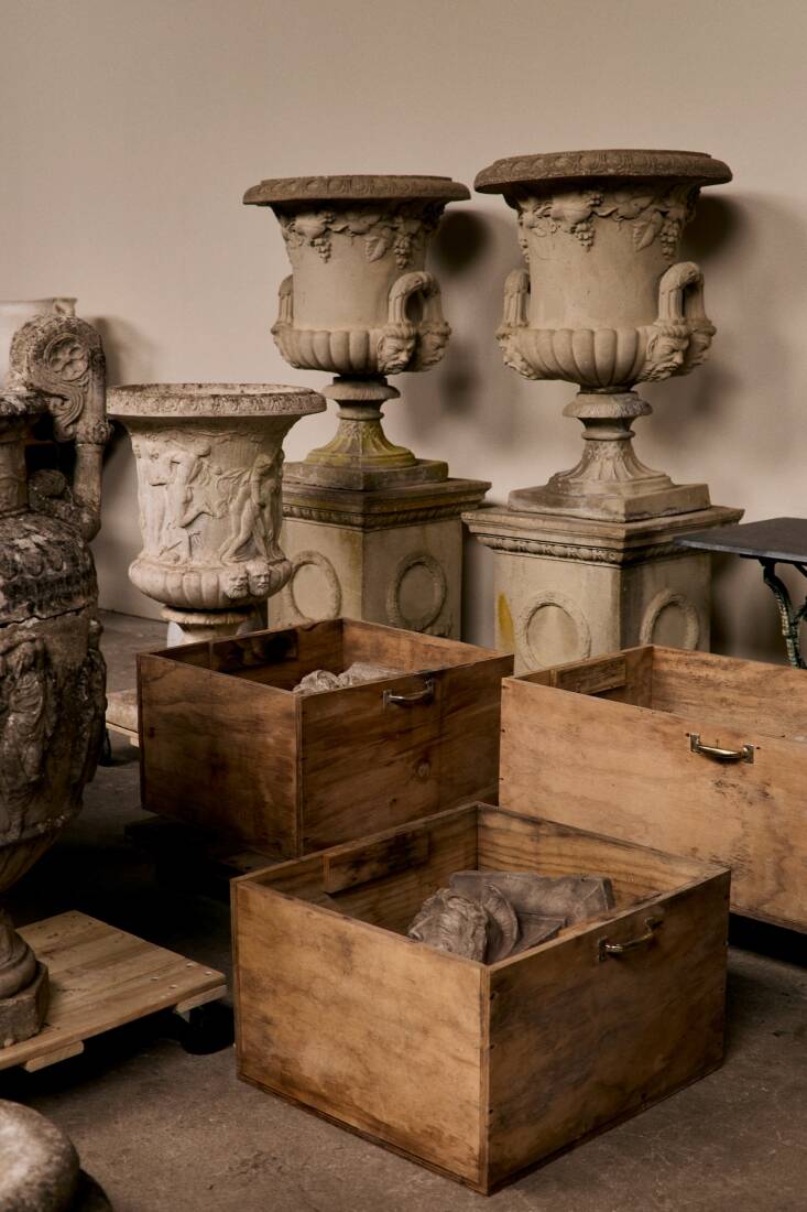 The Harrisons note that their offerings work well indoors as well as out. Shown here, a large Pair of Cast Stone Figural Garden Urns on wreath-decorated bases and a circa \1950 Classical Cast Stone Garden Urn.