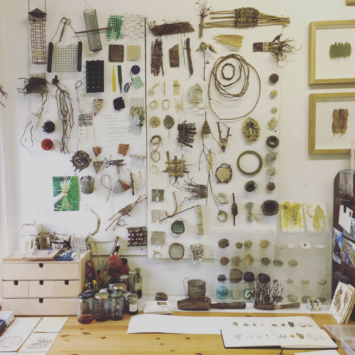 An example of one of Alice’s studio walls and desks, showing the beauty and scope of her practice-based research on Plot \105: making cordages, weaving, sculpting, botanical ink-making, drawing, inventing with found objects, photography, leaf-stitching, book-making, botanical contact-printing&#8\230; Photograph by Alice Fox.