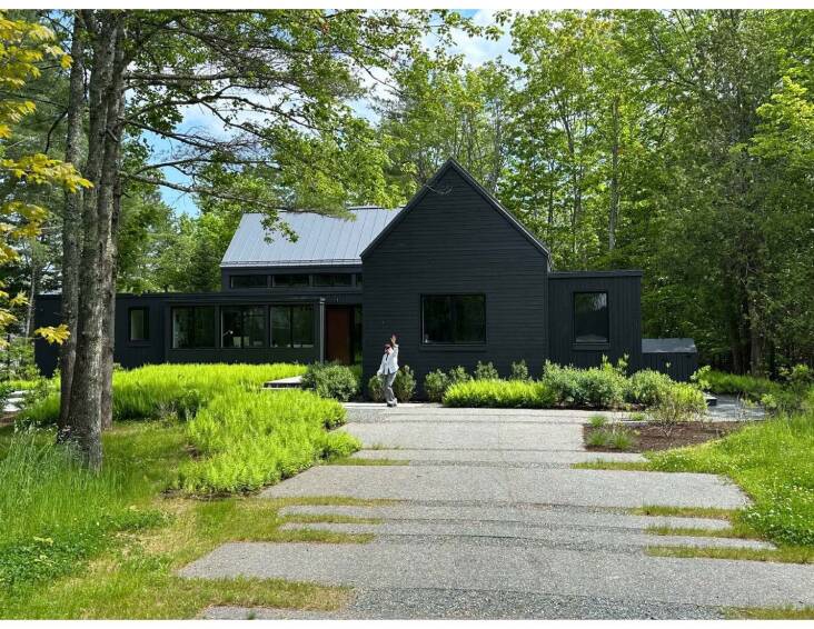 Landscape architect David Maynes found a low-impact way to reimagine a client’s asphalt driveway: He cut away sections of the asphalt creating “pavers” that lead to the house designed by Elliott Architects. Photograph by Bruce Richter.