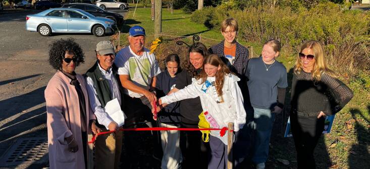 The rain garden ribbon cutting with students and community members. Photograph courtesy of Kirk Barrett.