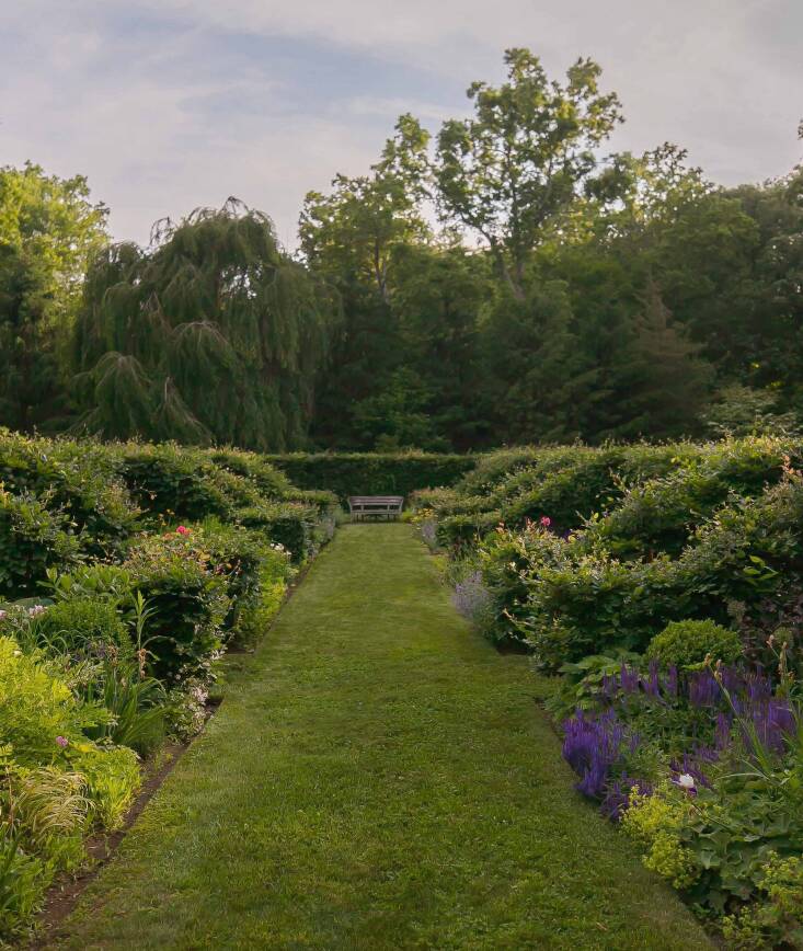 The \1\14-foot-long perennial garden is the subject of one chapter, and a favorite of both Herman and visitors. “The Fagus sylvatica hedging has arms that break the garden into \14 individual beds. Some serve as circulation, some contain perennials and boxwoods arranged by color, some are left green to serve as a visual palate cleanser,” she explains. Photograph by Neil Landino, from A Moment in Time.