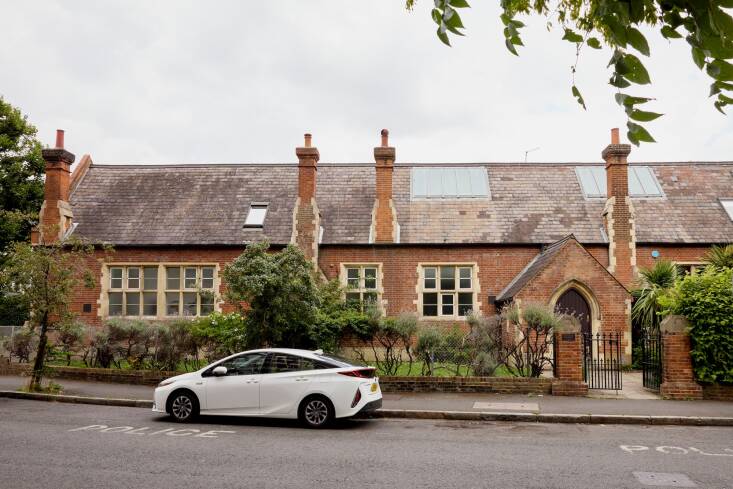 The building is constructed with Portland stone quoins and has a slate roof.