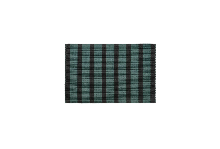 A stylish cotton door mat to lay at the threshold to your outdoor space. It\2\17;s available in green/black (pictured) and pink/orange. Shop now.
