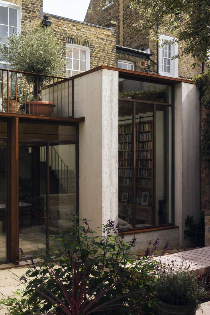 The wood grain texture of the concrete is apparent up close. Plus, seeded gravel joints between the Deerplay riven Yorkstone paving \2\20;encourage low growing plants in the cracks, giving a softer feeling to the patio area,\2\2\1; says Nathaniel.